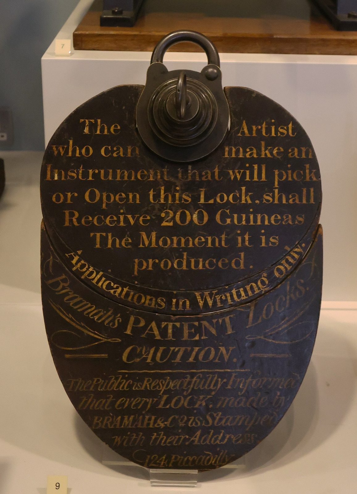 The Bramah challenge lock and its painted sign offering 200 guineas to whoever can pick it
